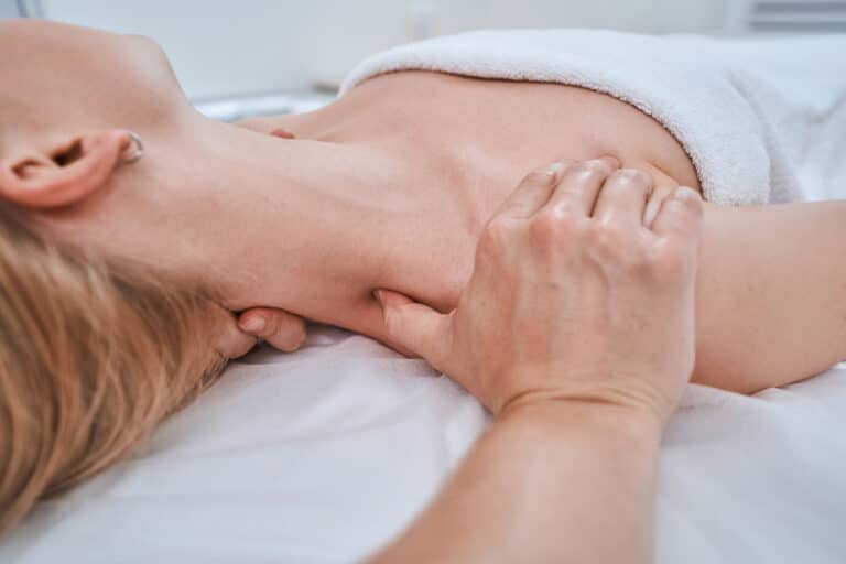 Spa client being treated for neck pain